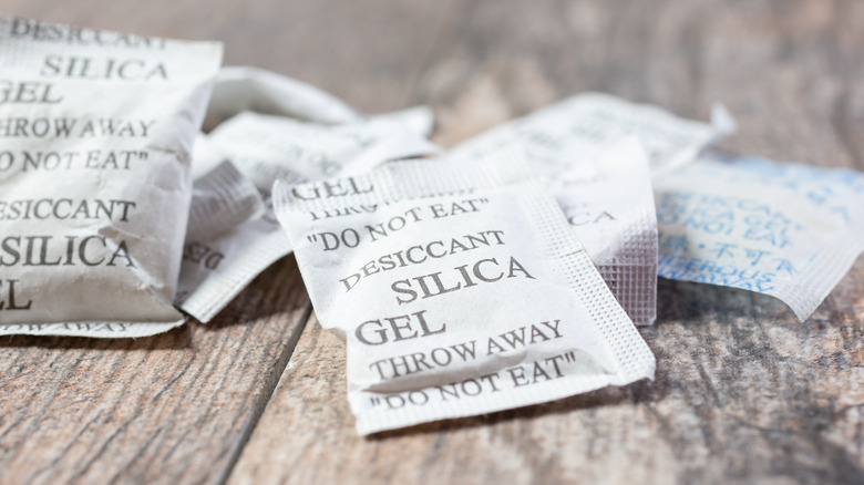 Silica gel packets on wood