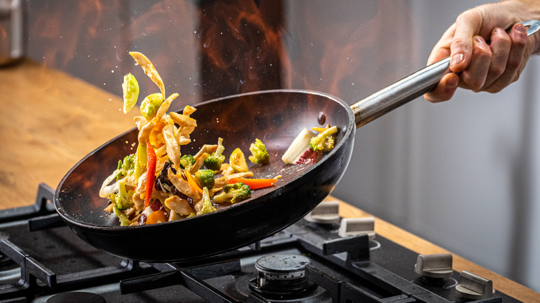 hand cooking stir fry