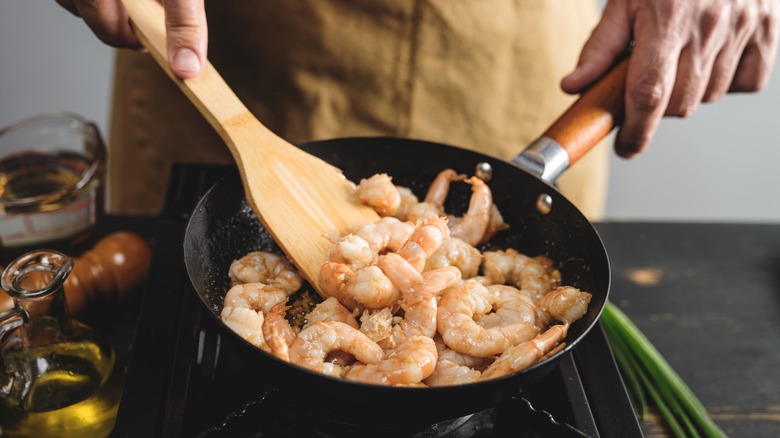 Cooking shrimp in pan 