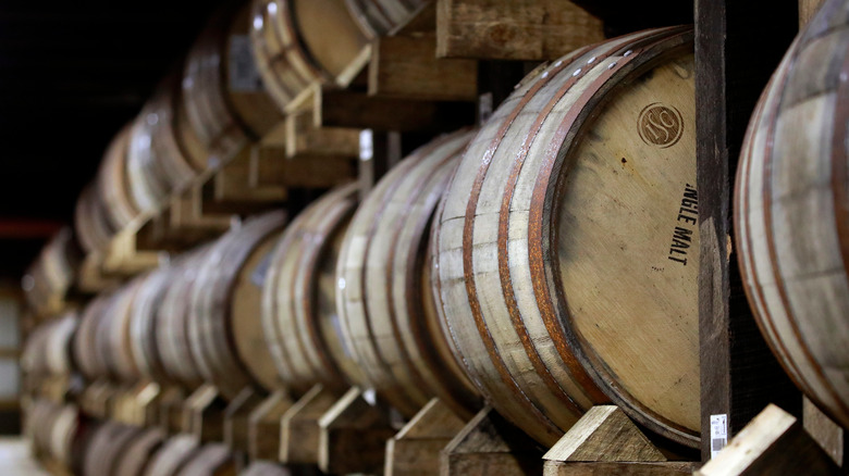 Bourbon barrels stacked in warehouse