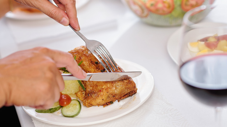 Cutting fried chicken 