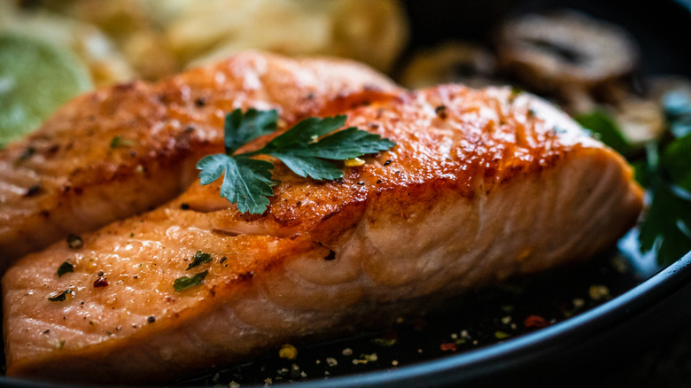 broiled salmon with parsley garnish