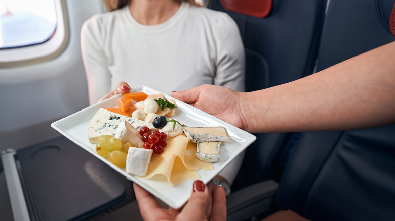 snacks on a plane being delivered 