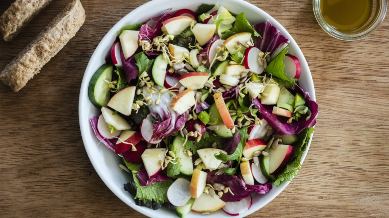 Chopped salad with apples and walnuts