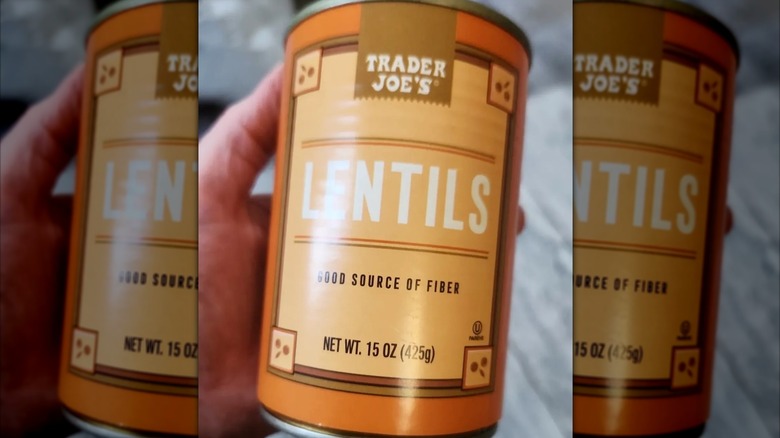 Hand holding Trader Joe's canned lentils