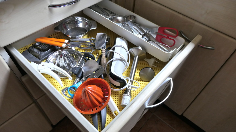 kitchen drawer full of utensils