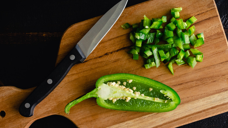 diced jalapeno peppers on cutting board
