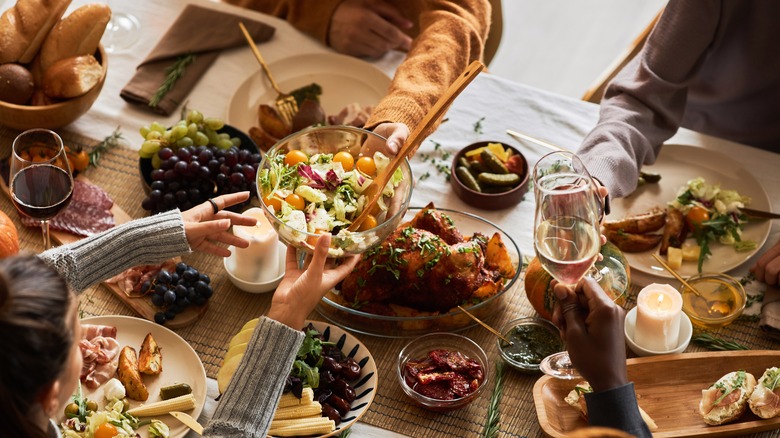 dinner party guests sharing food