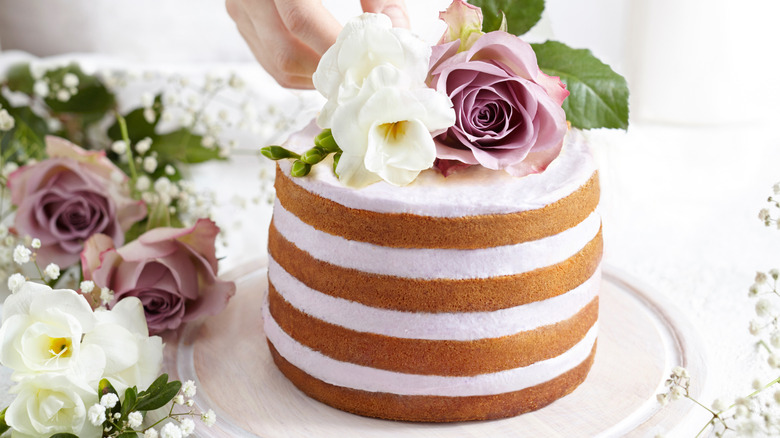 wedding cake with flowers atop