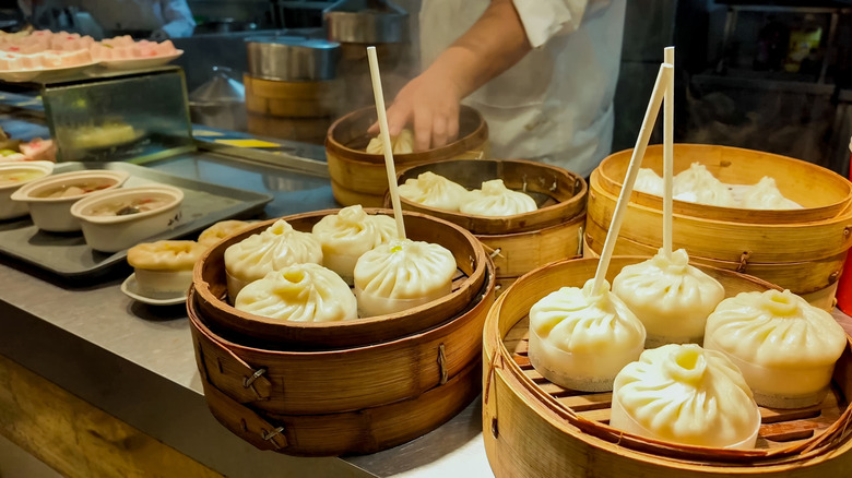 chinese soup dumplings with straws