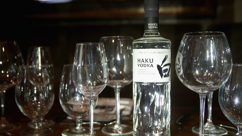 Haku vodka with glassware