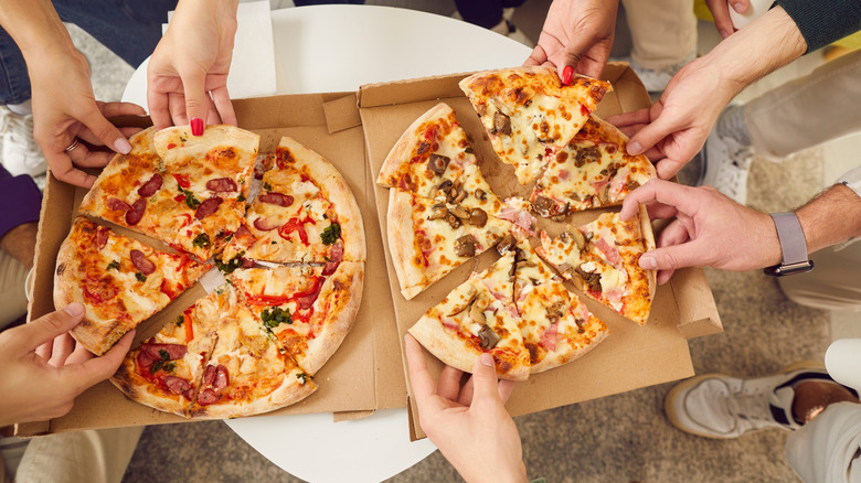 eating pizzas out of a box