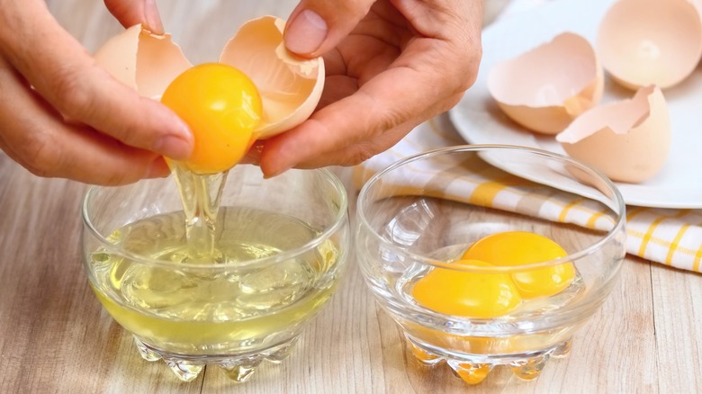 hands separating egg whites