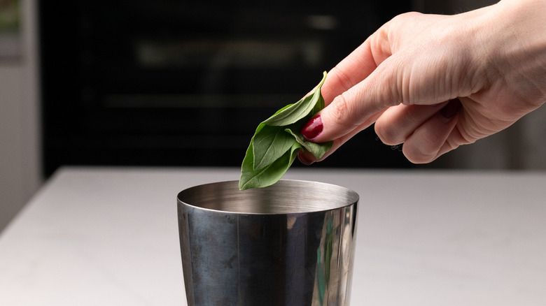 adding Thai basil to shaker
