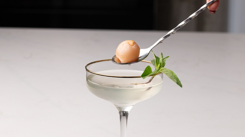 garnishing White Lotus-inspired martini