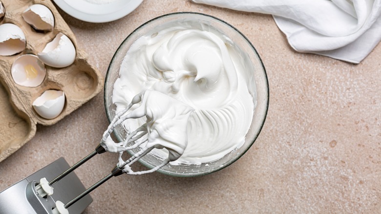 Bowl of meringue with mixer