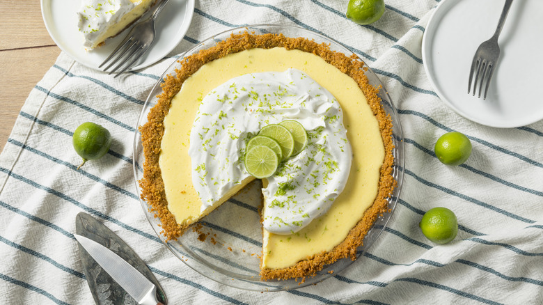 key lime pie with slice cut out