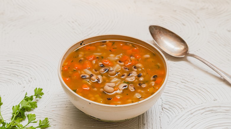 Bowl of black-eyed pea soup with spoon