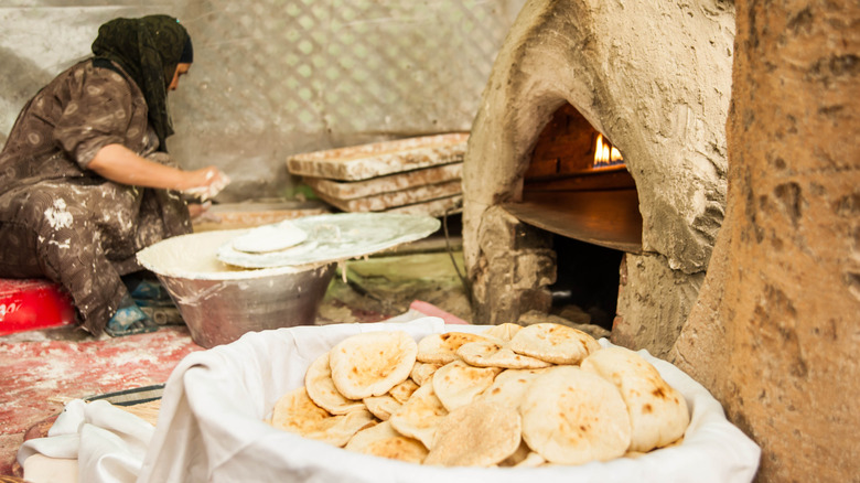 An Egyptian woman making bread