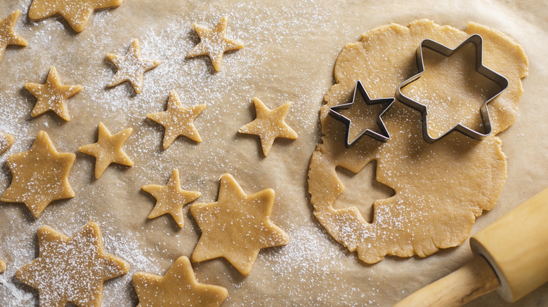 Gingerbread dough and star cookie cutters