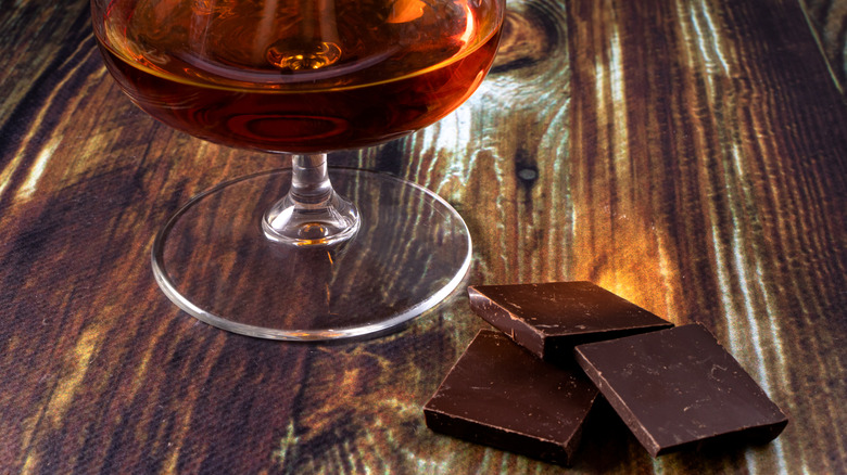 Bourbon and chocolate laid out on a wooden table
