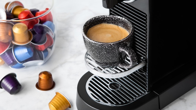 Nespresso machine with variety of coffee pods