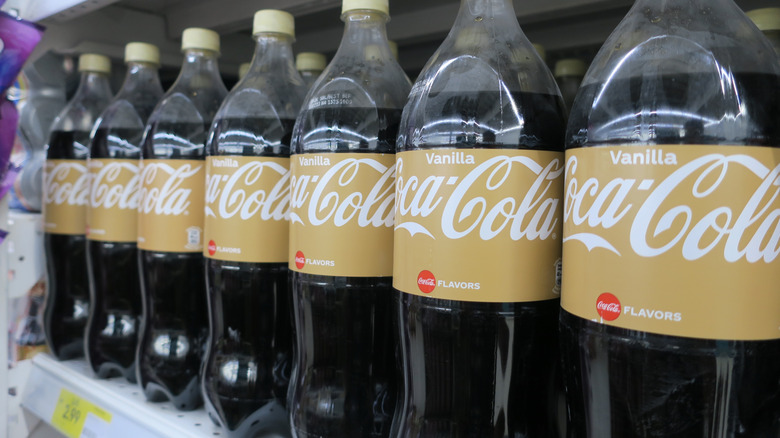 Bottles of Vanilla Coke on a grocery store shelf