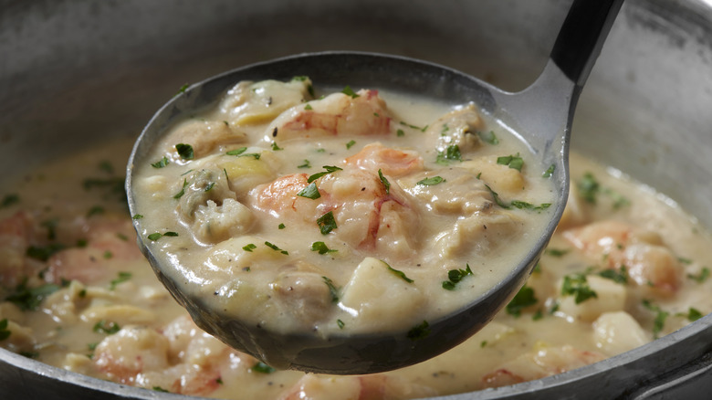 Ladle of seafood chowder 