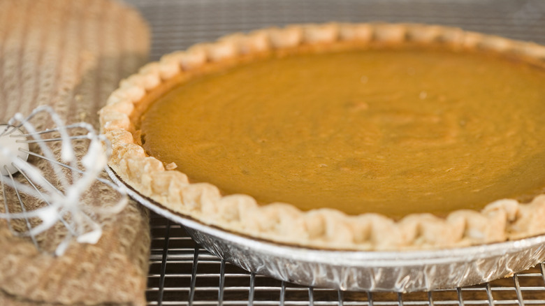 A freshly cut pumpkin pie