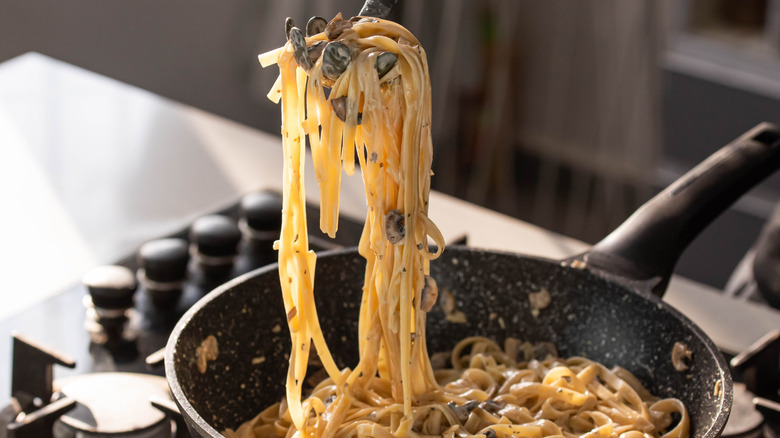 tagliatelle in creamy sauce in pan