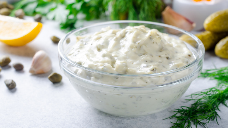 Thick tartar sauce in glass ramekin