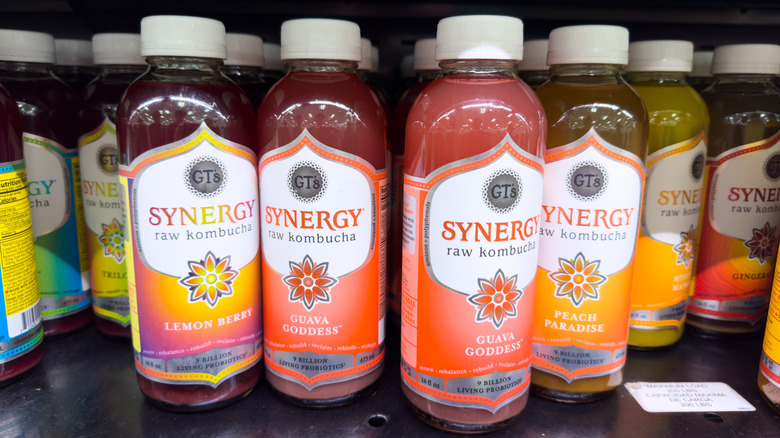 Bottles of Synergy kombucha on supermarket shelves