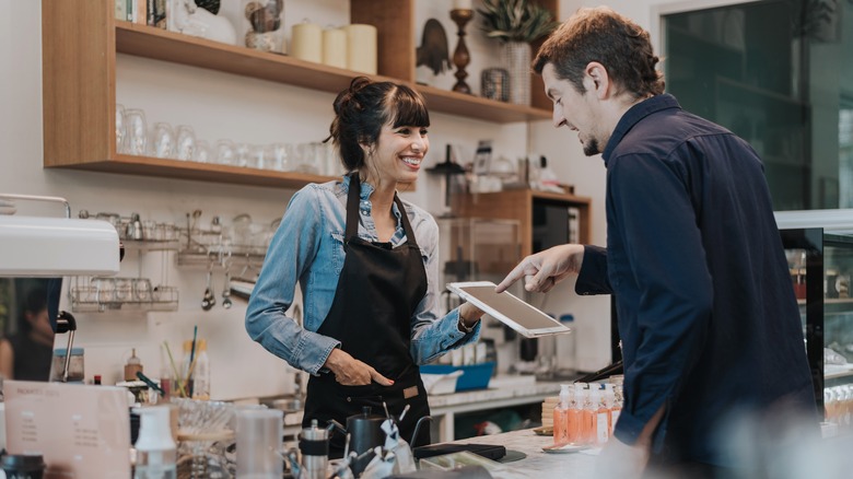 Coffee shop customer ordering a drink