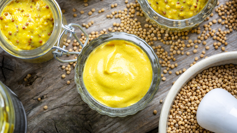 bowls of mustard and mustard seeds