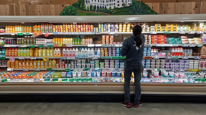 employee organizing products at Trader Joe's