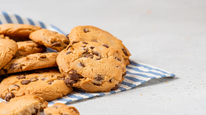 Chocolate chip cookies on blue and white towel