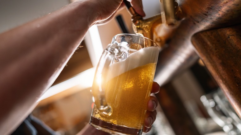 bartender pouring draft beer