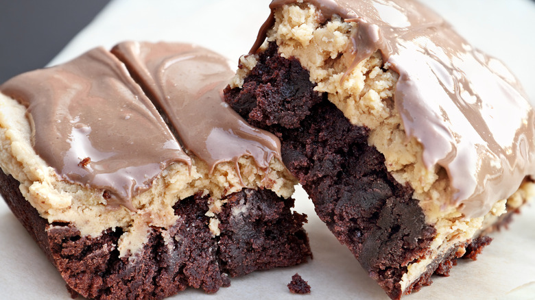 buckeye brownies with thick peanut butter topping and chocolate icing