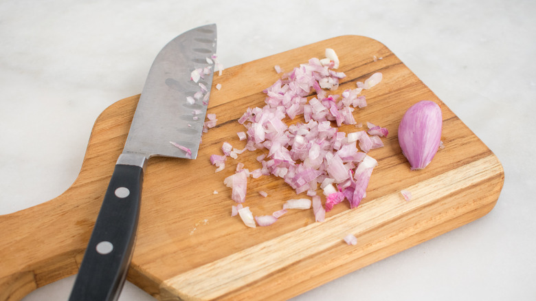 Diced shallots on cutting board