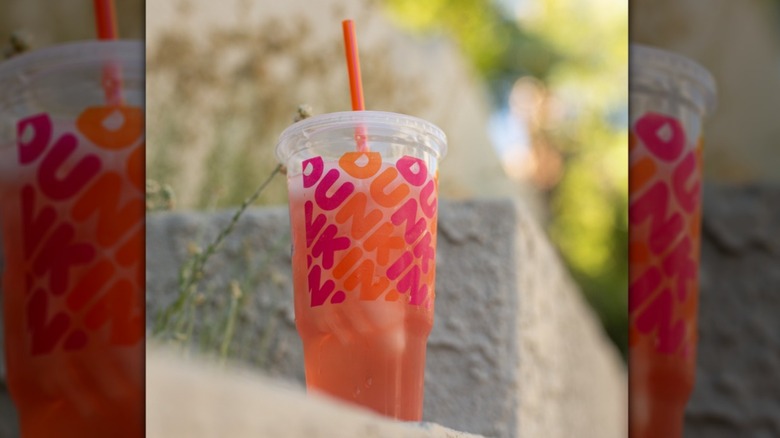 A Dunkin' Strawberry Dragonfruit Refresher outside