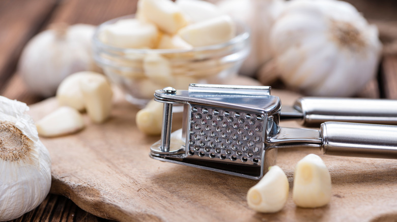 garlic bulbs and cloves on cutting board