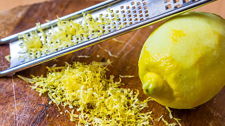 Lemon with a zester full of zest