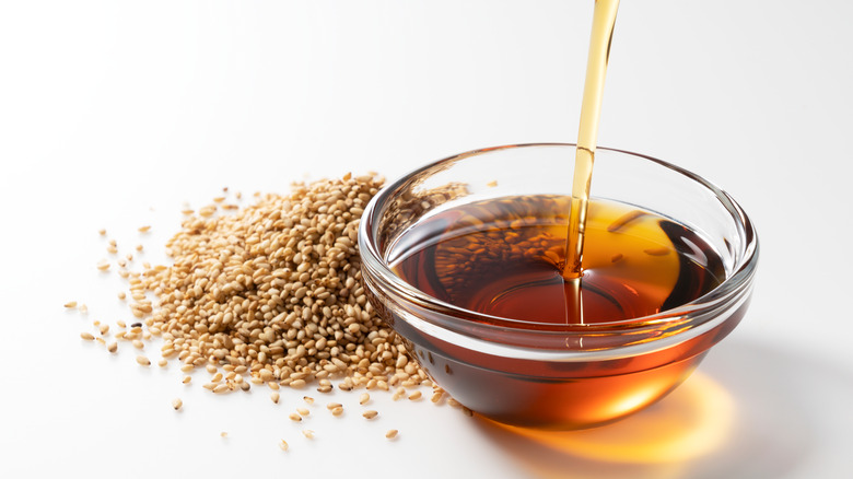 bowl of sesame oil and sesame seeds