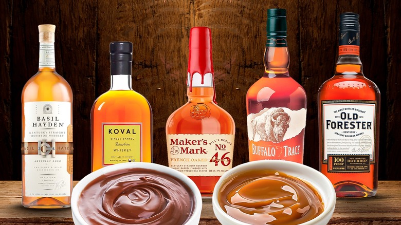 Five different bottles of bourbon with caramel and chocolate sauces