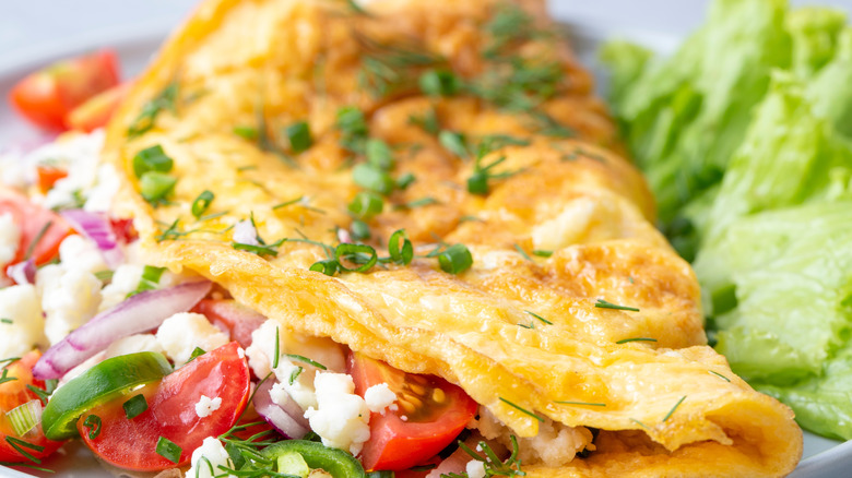 Omelet with tomatoes, herbs, and cheese