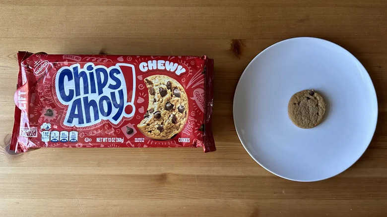 A package of Chewy Chips Ahoy! cookies next to a cookie on a plate