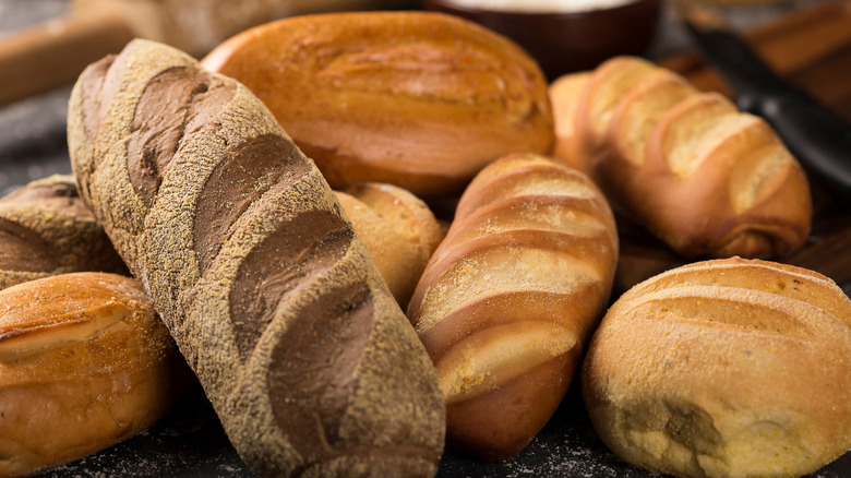 Various loaves of bread in a pile