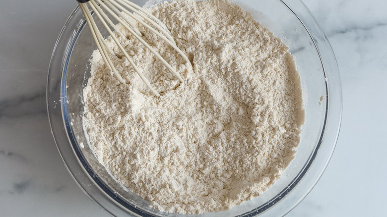 whisking flour in bowl