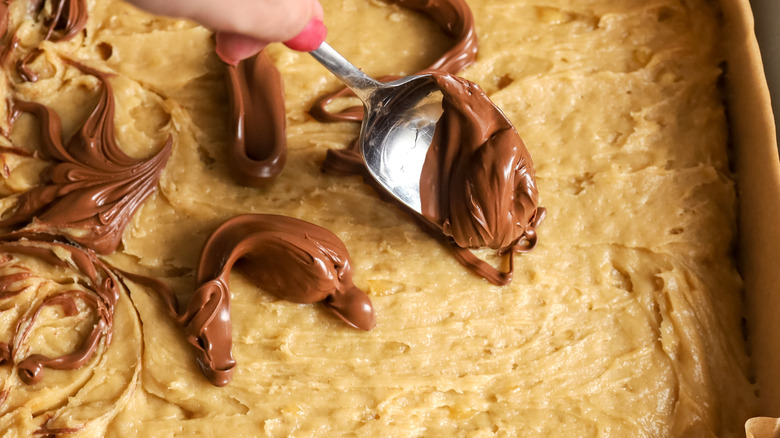 dolloping Nutella over batter