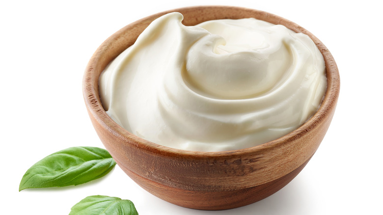 Yogurt in a wooden bowl